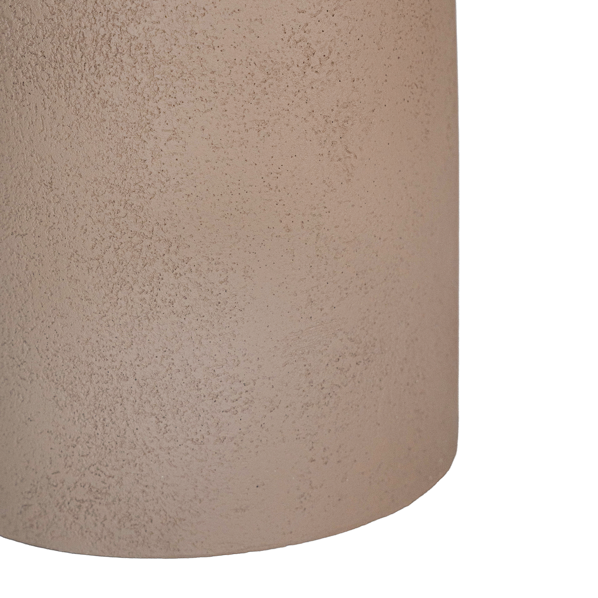 Tarran side table in nomad dune with sculptural pedestal base and rounded top shown in a clean minimal setting.