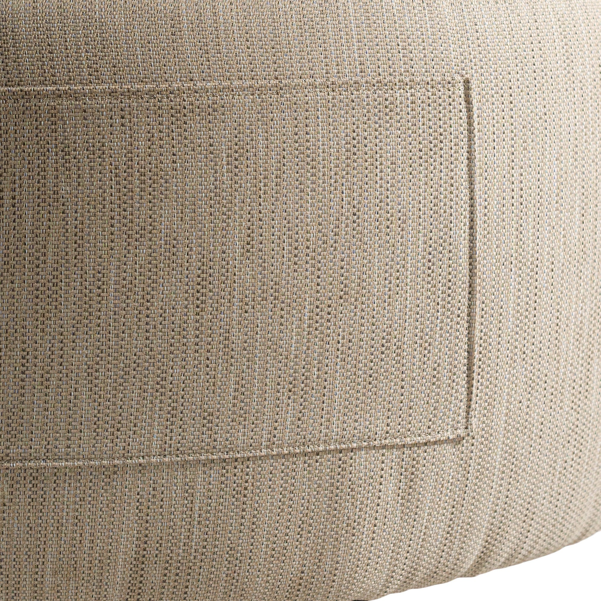 A contemporary latte upholstered lounge chair with a low-profile design and curved backrest. This modern, armless seating piece features a smooth, rounded silhouette, making it a stylish and comfortable addition to any living space