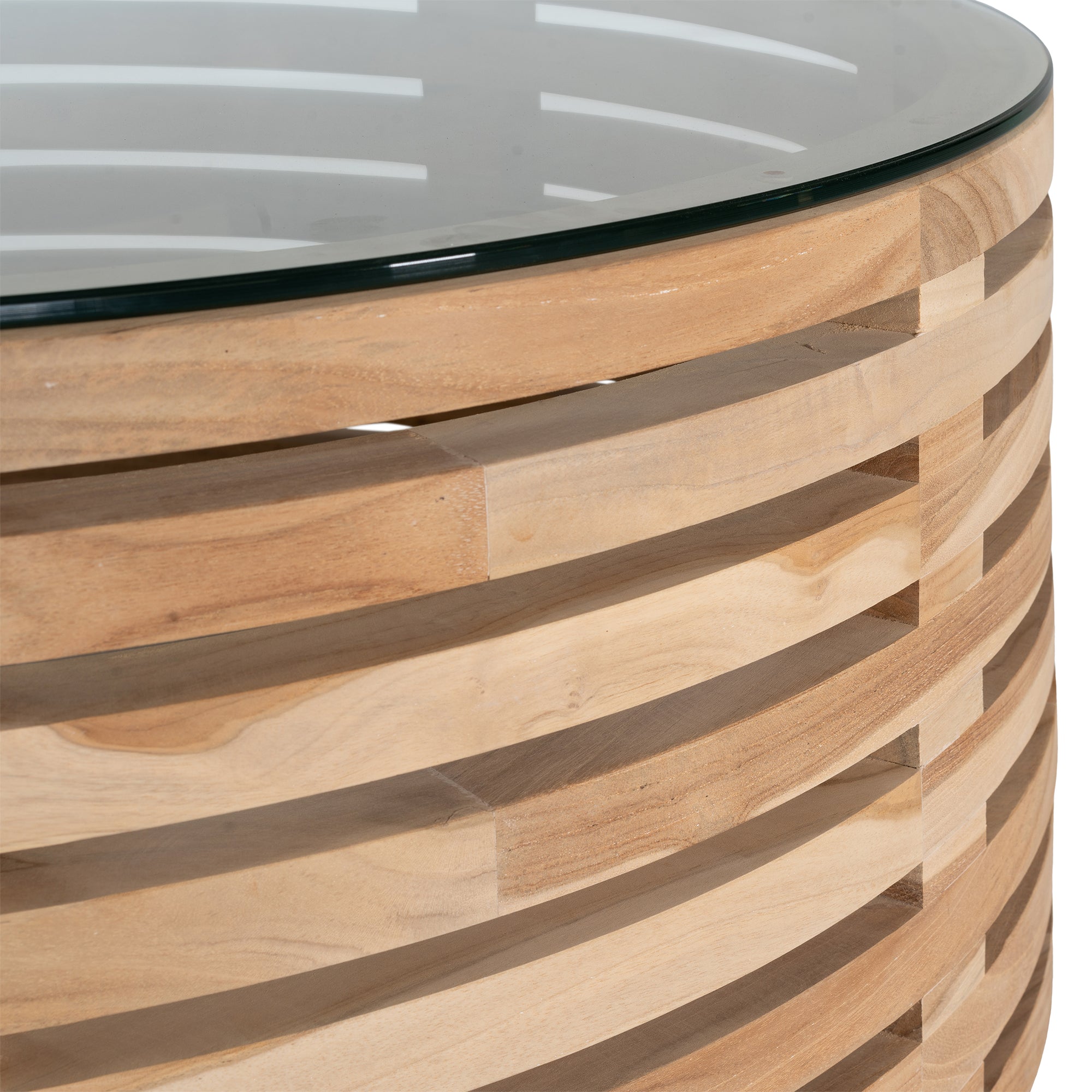 The Kulala Living Teak and Glass Coffee Table features a beautifully crafted open-weave teak base with a round glass top. This contemporary design blends natural warmth with modern elegance, making it a stylish centrepiece for any living space.