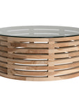The Kulala Living Teak and Glass Coffee Table features a beautifully crafted open-weave teak base with a round glass top. This contemporary design blends natural warmth with modern elegance, making it a stylish centrepiece for any living space