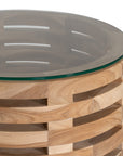 The Kulala Living Teak and Glass Coffee Table features a beautifully crafted open-weave teak base with a round glass top. This contemporary design blends natural warmth with modern elegance, making it a stylish centrepiece for any living space.