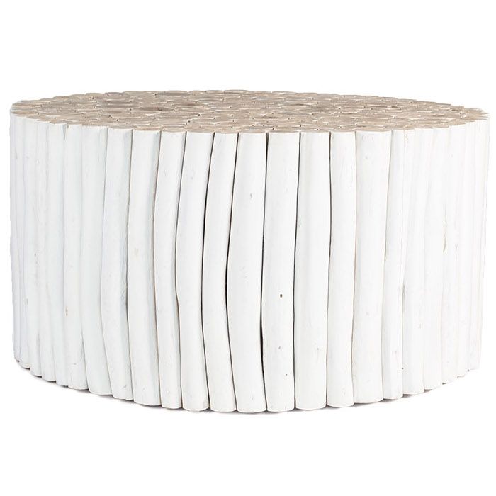A round coffee table crafted from natural teak branches, arranged in a drum-style design. The organic texture and neutral tones make it a statement piece for coastal and contemporary interiors