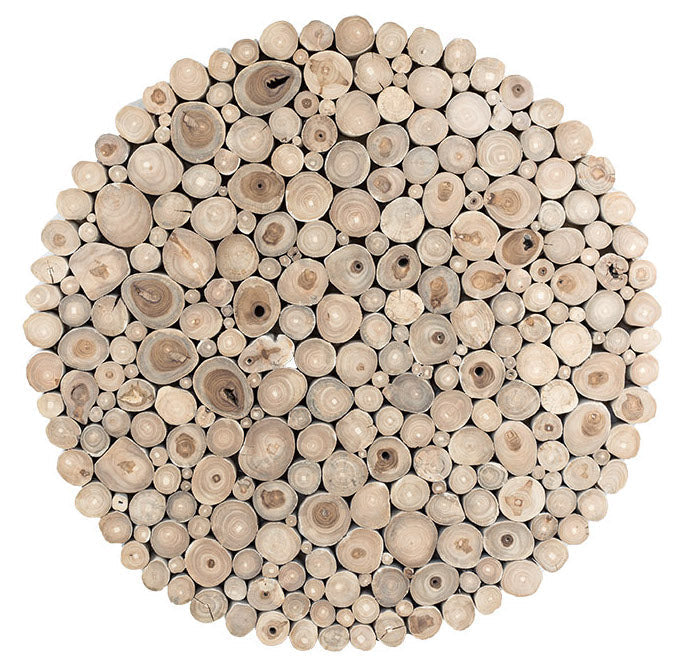 A round coffee table crafted from natural teak branches, arranged in a drum-style design. The organic texture and neutral tones make it a statement piece for coastal and contemporary interiors