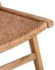 A beautifully handcrafted lounge chair featuring a solid teak wood frame and a woven tan leather seat and backrest. Designed for comfort and style, this contemporary accent chair is perfect for relaxed indoor settings
