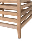 A contemporary teak outdoor dining chair featuring a striking slatted design and a taupe seat cushion for added comfort. Perfect for stylish alfresco dining