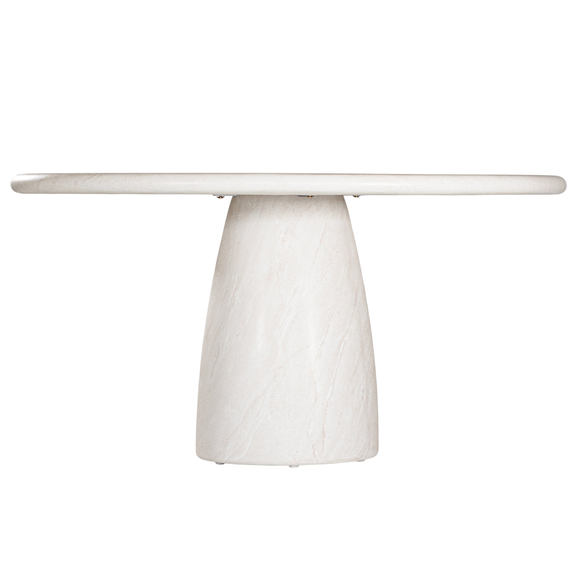 A luxurious round dining table crafted from natural travertine stone, featuring a sculptural pedestal base and smooth, polished finish. Perfect for contemporary and minimalist interiors