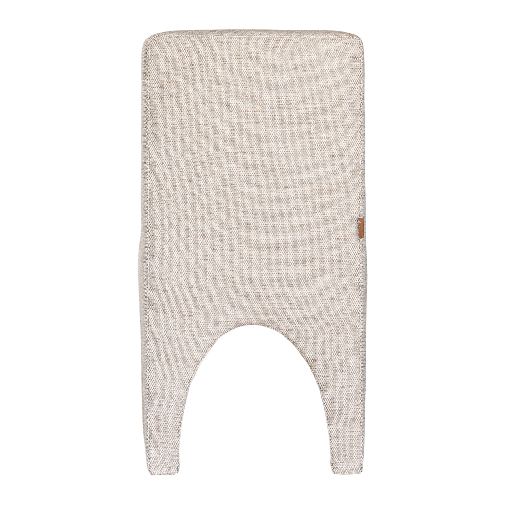 Contemporary arched dining chair upholstered in natural fabric, featuring sculptural curves and modern silhouette for refined dining spaces