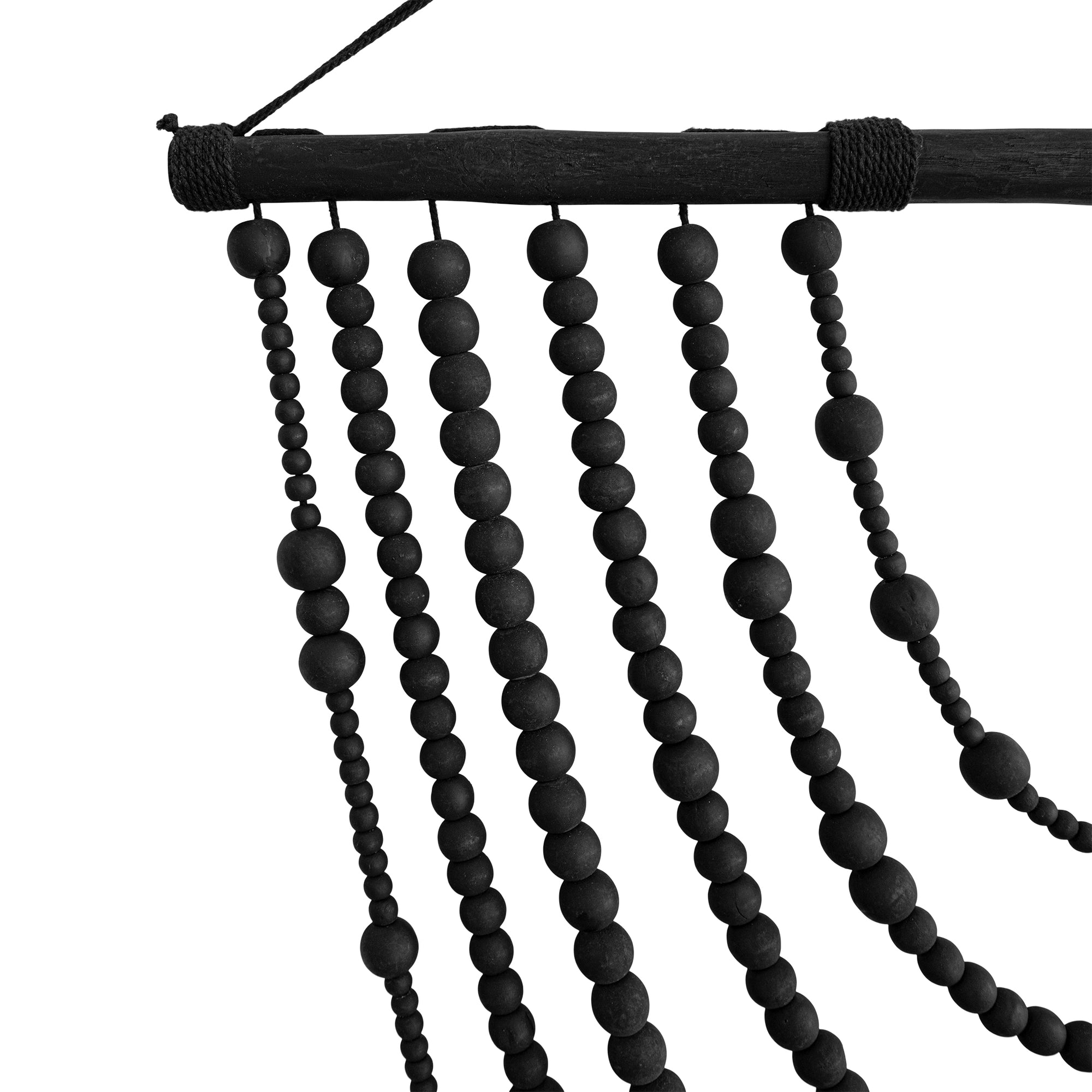 Black wooden beaded wall hanging with layered strands, creating a bold decorative statement for modern interiors