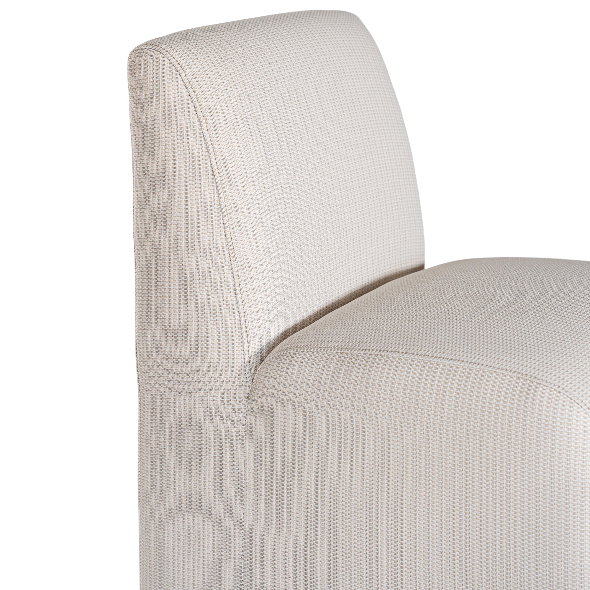 Elegant white upholstered dining chair with a modern, curved silhouette and a seamless design, perfect for contemporary and minimalist outdoors