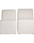 Elegant white upholstered dining chair with a modern, curved silhouette and a seamless design, perfect for contemporary and minimalist outdoors