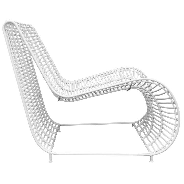 Sleek white rattan lounge chair with a modern curved silhouette and sturdy metal frame, perfect for outdoor or indoor relaxation spaces