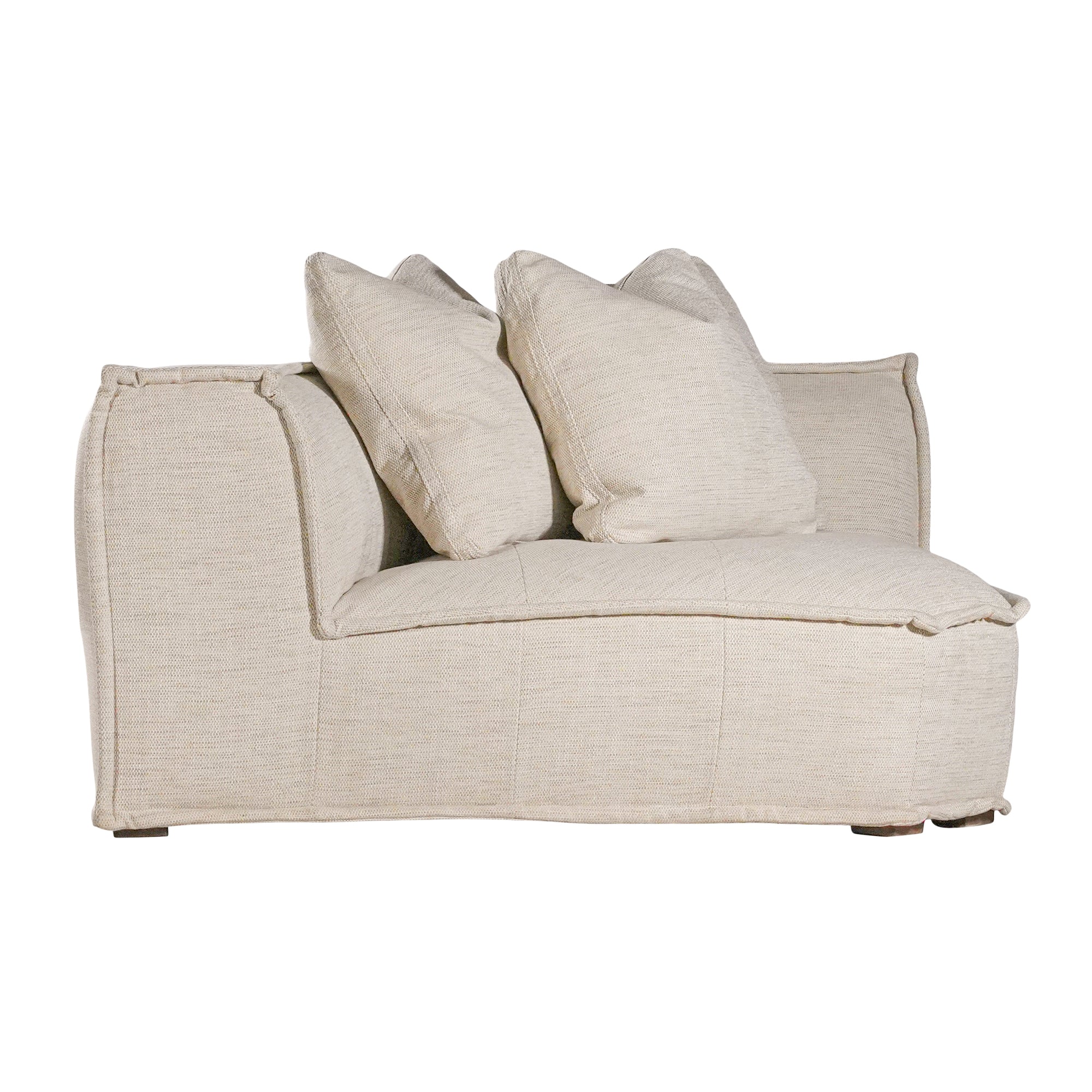 Luxurious modern curved sectional sofa with soft neutral upholstery and plush cushions, designed for ultimate comfort and contemporary living spaces