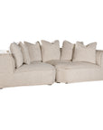 Luxurious modern curved sectional sofa with soft neutral upholstery and plush cushions, designed for ultimate comfort and contemporary living spaces