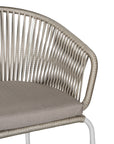 White and natural outdoor dining chair featuring a woven rope backrest and sleek metal legs, designed for modern alfresco dining and stylish patio settings