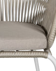 White and natural outdoor dining chair featuring a woven rope backrest and sleek metal legs, designed for modern alfresco dining and stylish patio settings