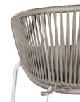 White and natural outdoor dining chair featuring a woven rope backrest and sleek metal legs, designed for modern alfresco dining and stylish patio settings
