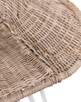 White natural rattan bar chair with curved back and slim metal legs, perfect for modern and stylish dining settings