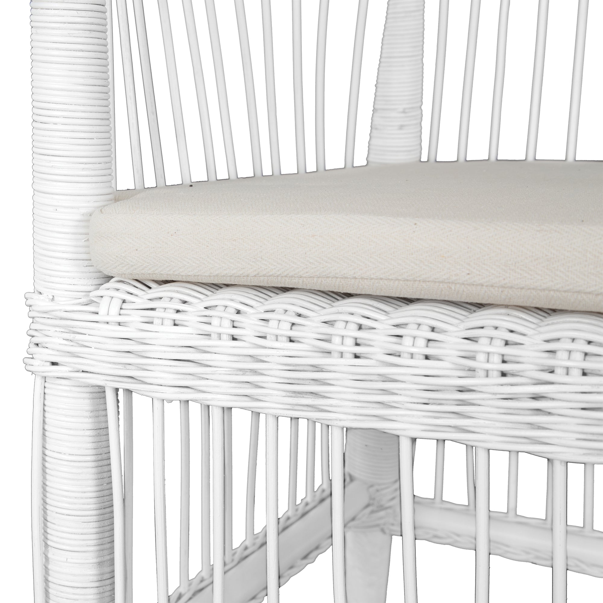 A beautifully crafted white rattan armchair with an open-weave design and a white cushioned seat, perfect for adding a relaxed coastal touch to any space
