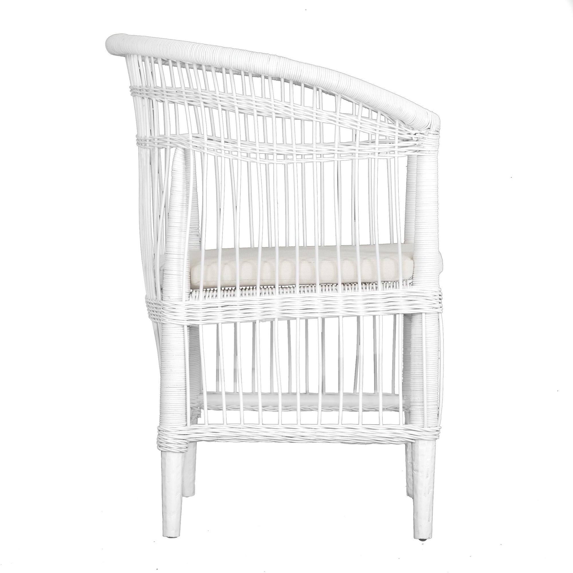 A beautifully crafted white rattan armchair with an open-weave design and a white cushioned seat, perfect for adding a relaxed coastal touch to any space