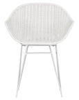 White rattan dining chair with curved back and slim metal legs, perfect for modern and stylish dining settings