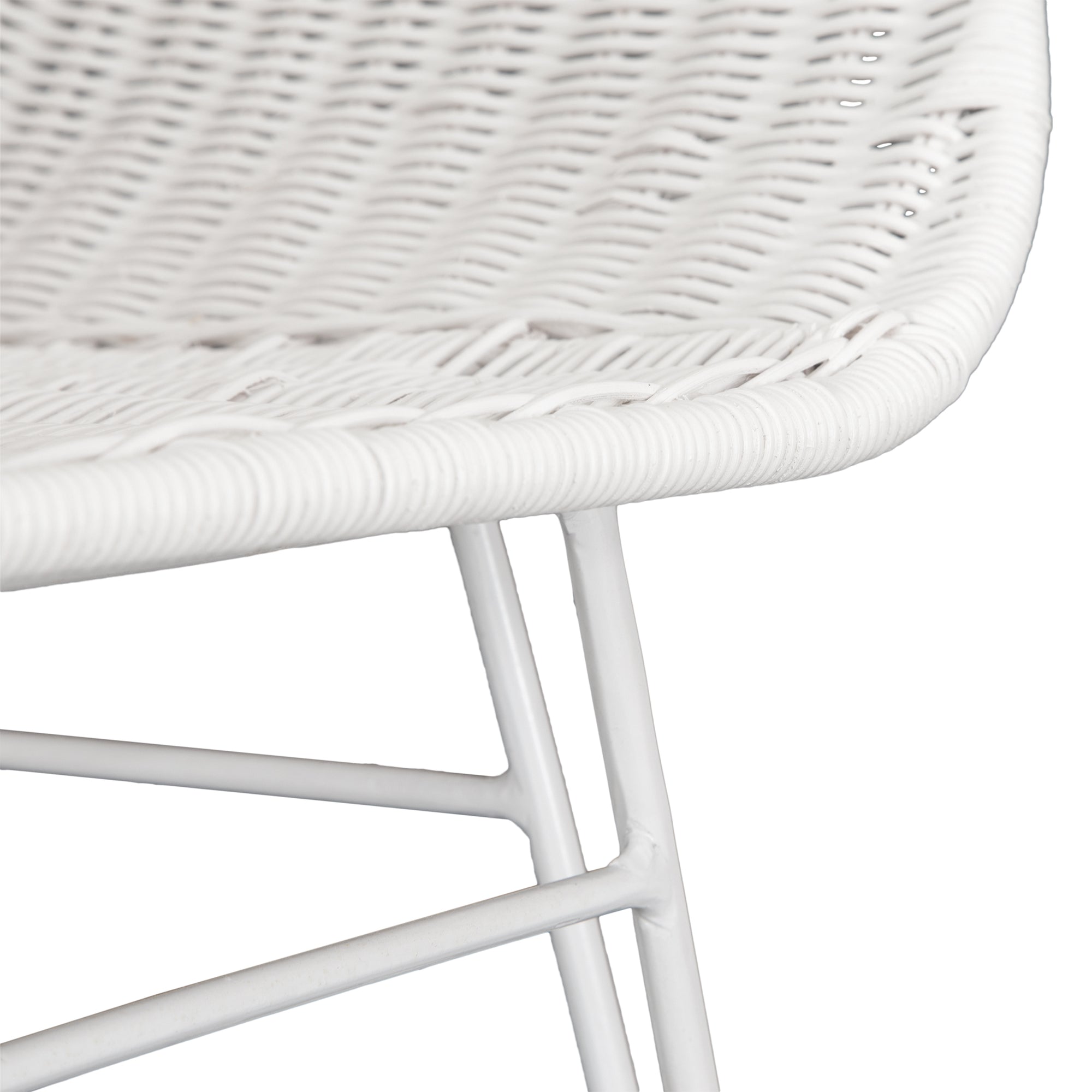 White rattan dining chair with curved back and slim metal legs, perfect for modern and stylish dining settings