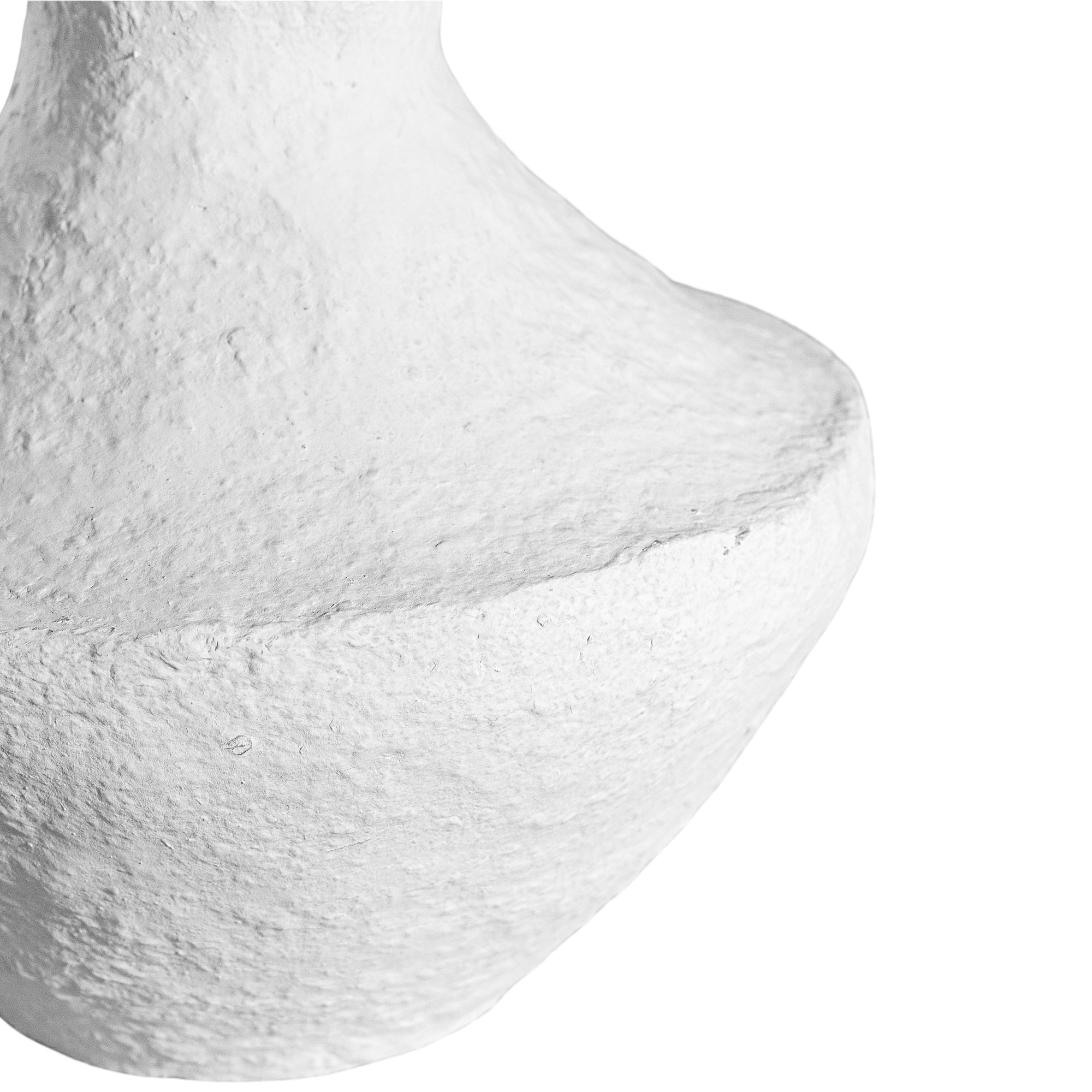 A sculptural white decorative vase with a textured finish, adding an organic, artisanal touch to modern interiors
