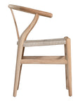 A natural timber wishbone dining chair with a handwoven rope seat, featuring an iconic curved backrest and minimalist Scandinavian-inspired design. Perfect for modern coastal and contemporary interiors, offering both style and comfort