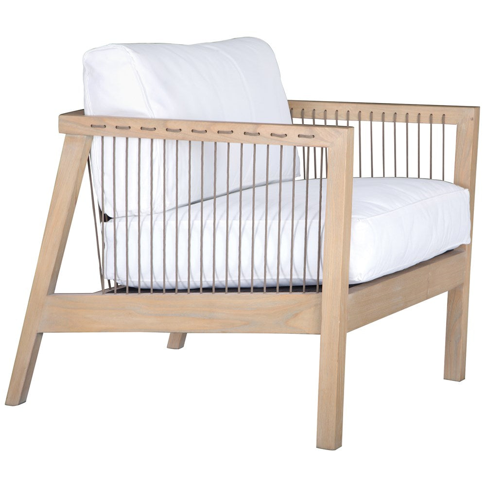 Wooden accent chair with white cushions and sleek spindle detailing, perfect for modern coastal and relaxed living spaces