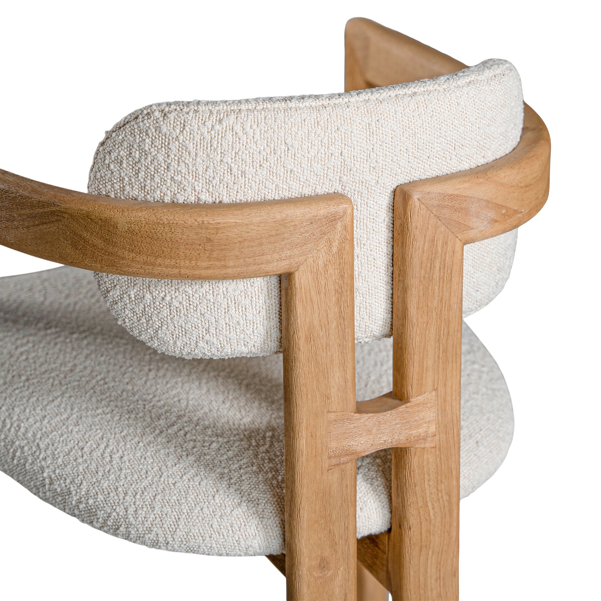 Contemporary wooden arm chair with a natural oak frame and boucle upholstered seat and backrest, designed for modern comfort and style