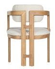 Contemporary wooden dining chair with a natural oak frame and boucle upholstered seat and backrest, designed for modern comfort and style