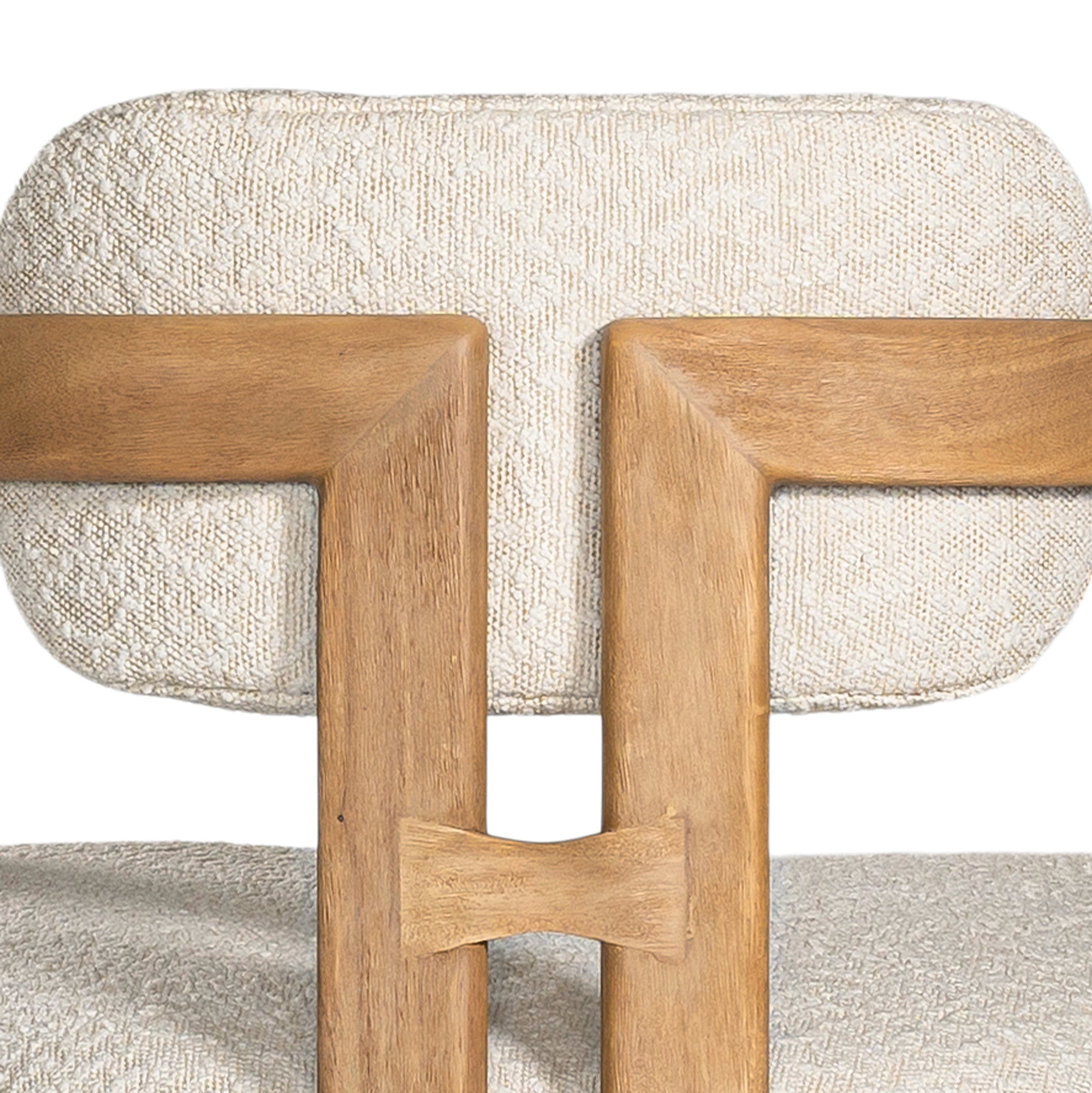 Contemporary wooden dining chair with a natural oak frame and boucle upholstered seat and backrest, designed for modern comfort and style