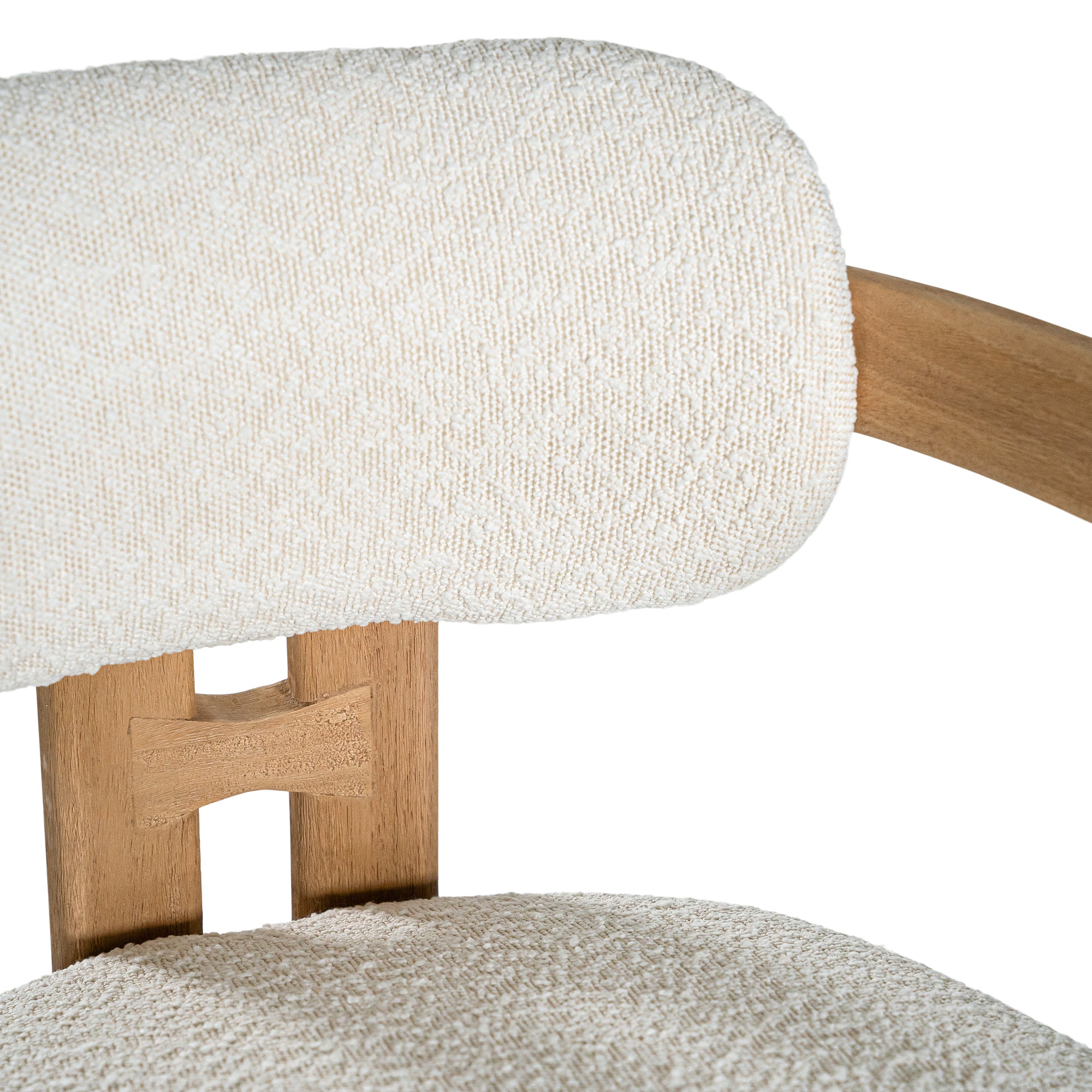 Contemporary wooden dining chair with a natural oak frame and boucle upholstered seat and backrest, designed for modern comfort and style