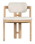 Contemporary wooden dining chair with a natural oak frame and boucle upholstered seat and backrest, designed for modern comfort and style