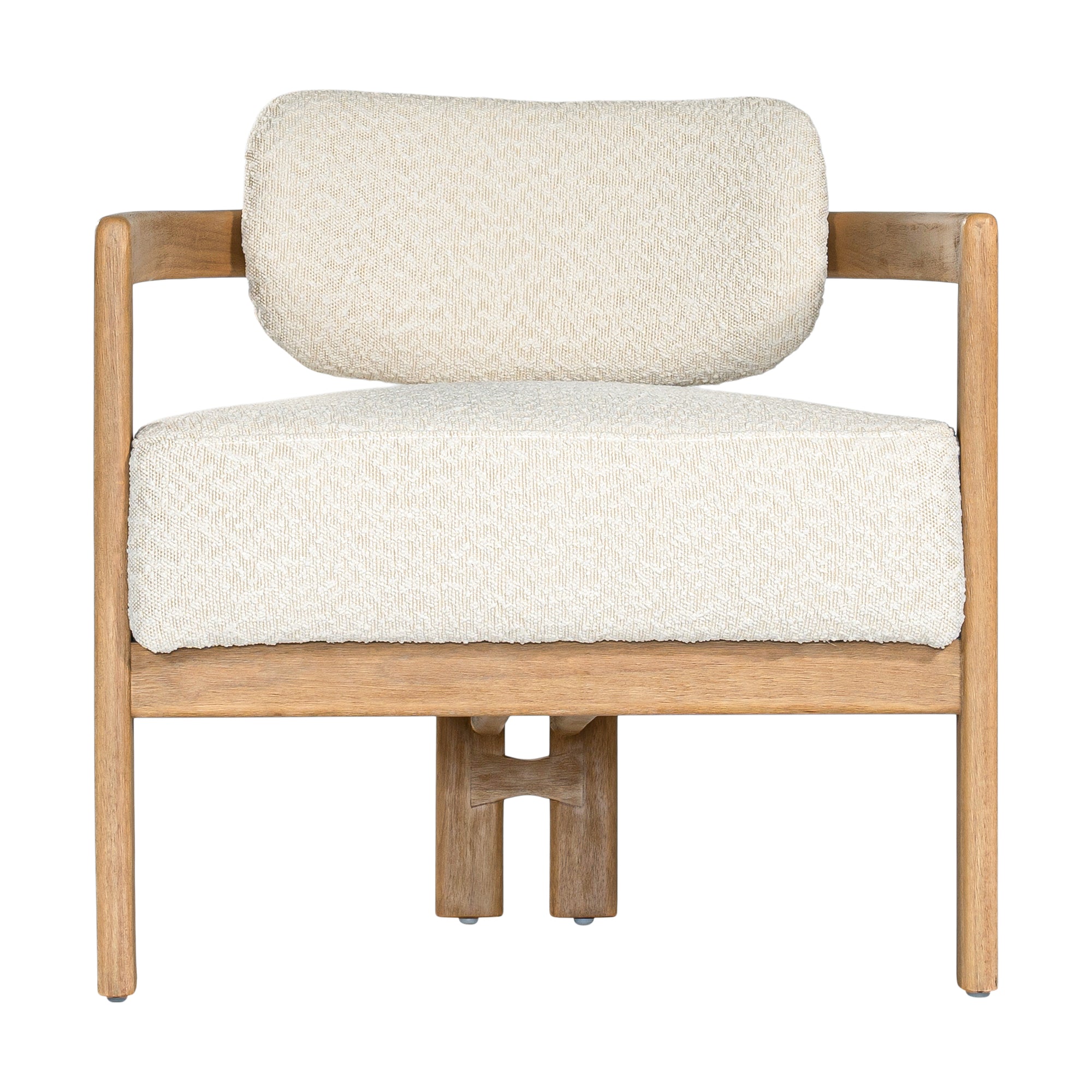 Stylish wooden occasional chair with boucle upholstery, set in a minimalist dining space with a sculptural stone table and an olive tree in a textured planter