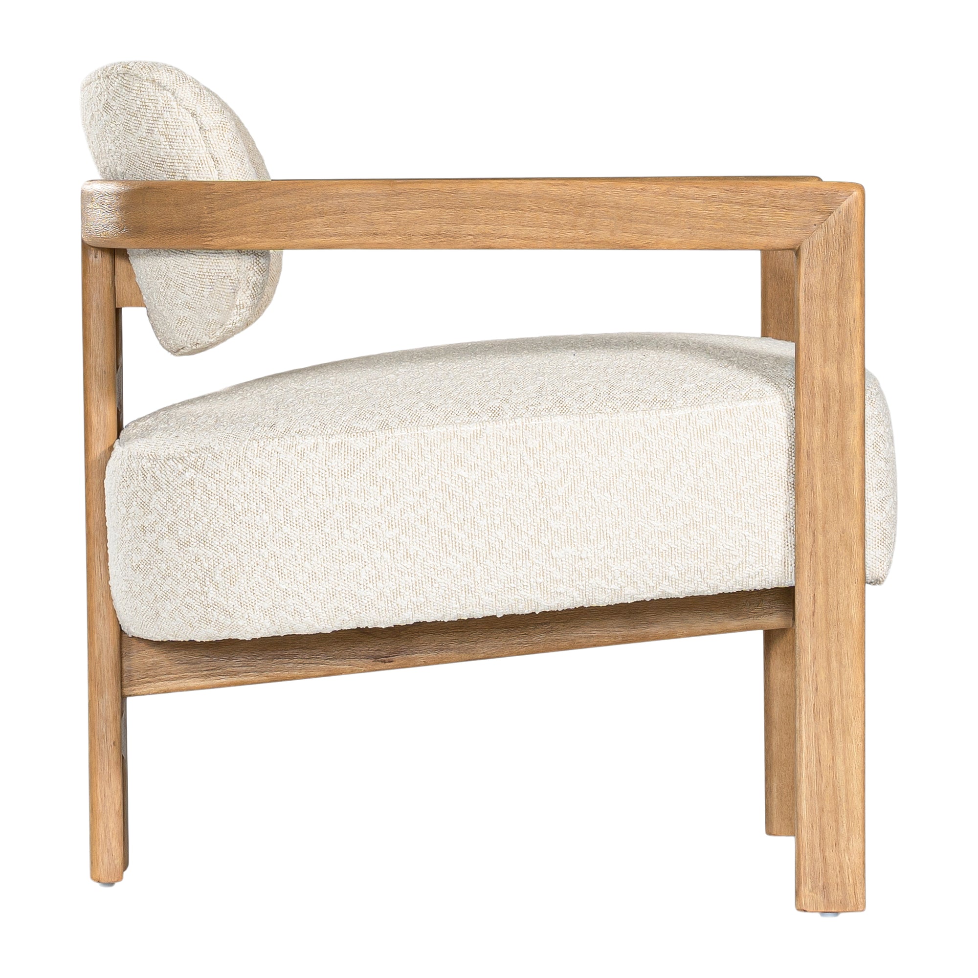 Stylish wooden occasional chair with boucle upholstery, set in a minimalist dining space with a sculptural stone table and an olive tree in a textured planter