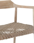 Wooden dining chair with natural rope woven seat and curved backrest, showcasing artisanal craftsmanship and rustic elegance.