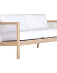 Wooden two seater sofa with white cushions and sleek spindle detailing, perfect for modern coastal and relaxed living spaces
