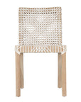 Woven leather armchair with natural wood frame, showcasing intricate handwoven craftsmanship and earthy, relaxed style