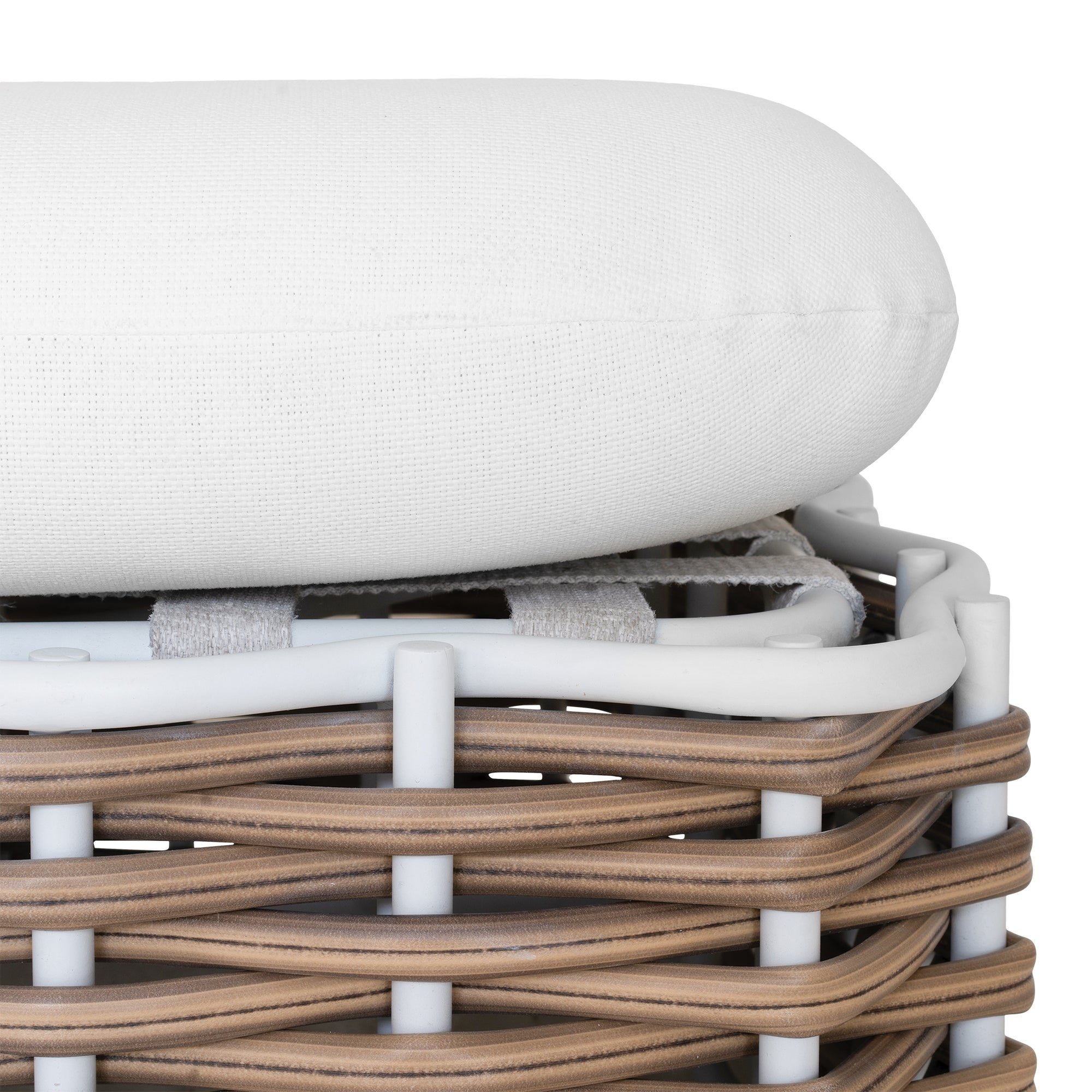 Stylish outdoor rattan ottoman with white cushions, perfect for creating a comfortable and modern alfresco space