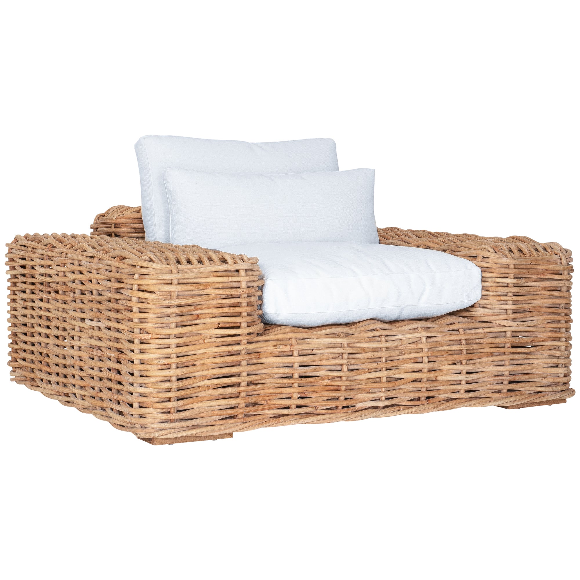 Natural wicker armchair with thick white cushions, showcasing a coastal-inspired design perfect for indoor and outdoor settings