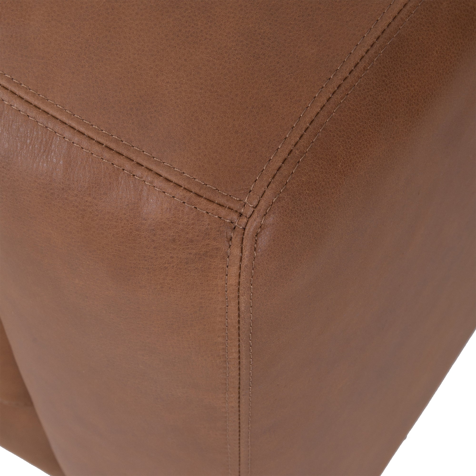 Modern leather upholstered sofa with soft, rounded cushions and light wooden legs