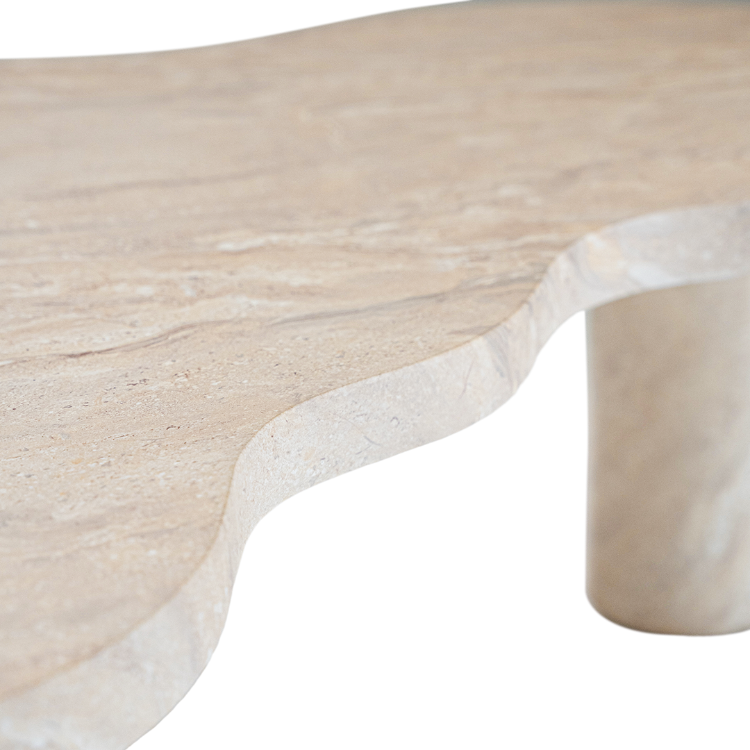 Zuburu coffee table in dune hydro dipped finish with organic shaped top and three cylindrical pedestal legs.