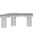 Zuburu coffee table in white concrete finish with organic curved tabletop and cylindrical pillar legs.