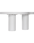 Zuburu coffee table in white concrete finish with organic curved tabletop and cylindrical pillar legs.