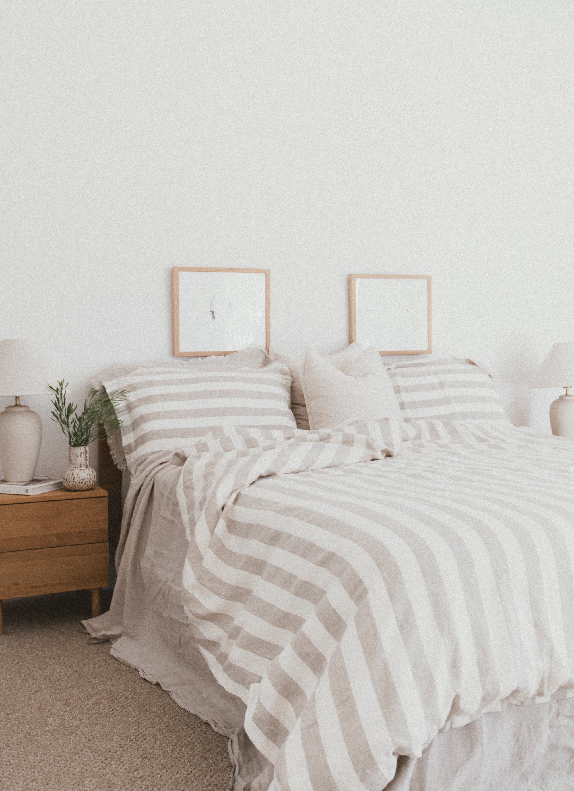 SOL Linen Noemi linen duvet cover displayed on a bed with a modern, minimalist bedroom setting featuring neutral tones.