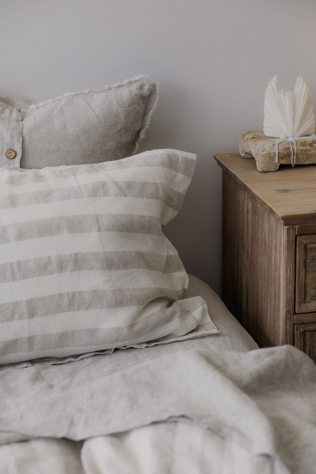Set of two SOL Linen Noemi linen pillowcases for bedding, featuring soft, natural fabric in a cozy bedroom setting.