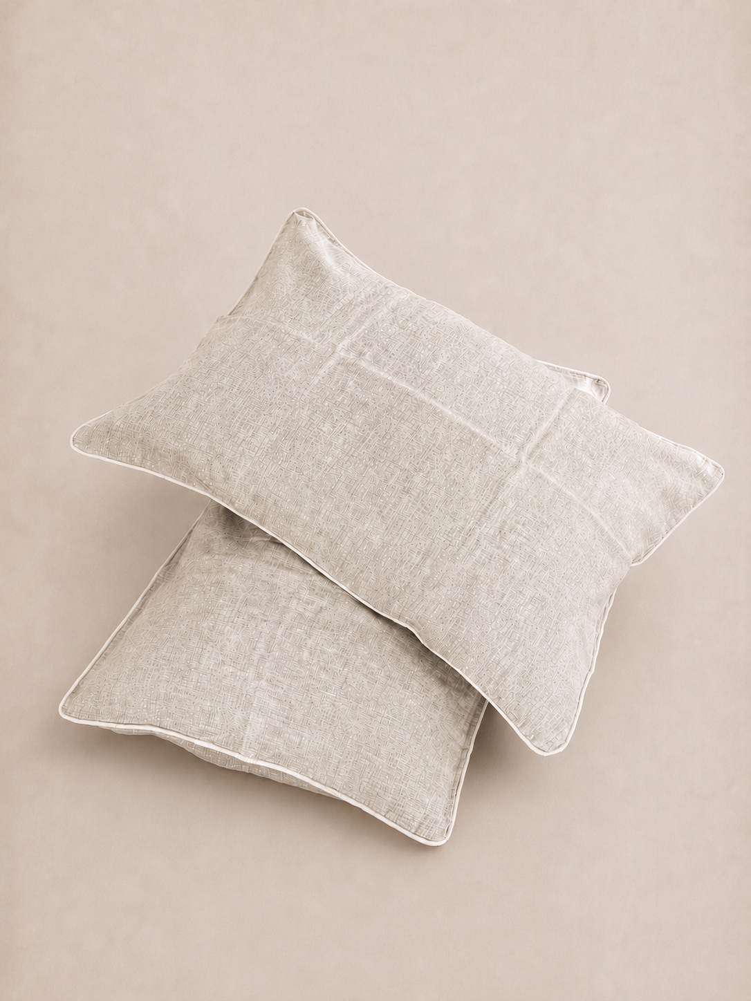 SOL Linen Rowie piped linen pillowcases in neutral tones, showcasing soft, breathable bedding design for a cozy bedroom setting.