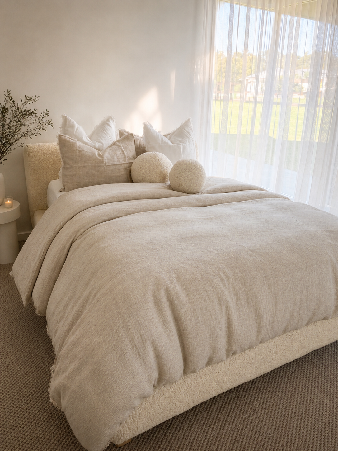 SOL Linen Sable frayed linen duvet cover shown on a bed, highlighting its soft, textured fabric and relaxed bedding style.