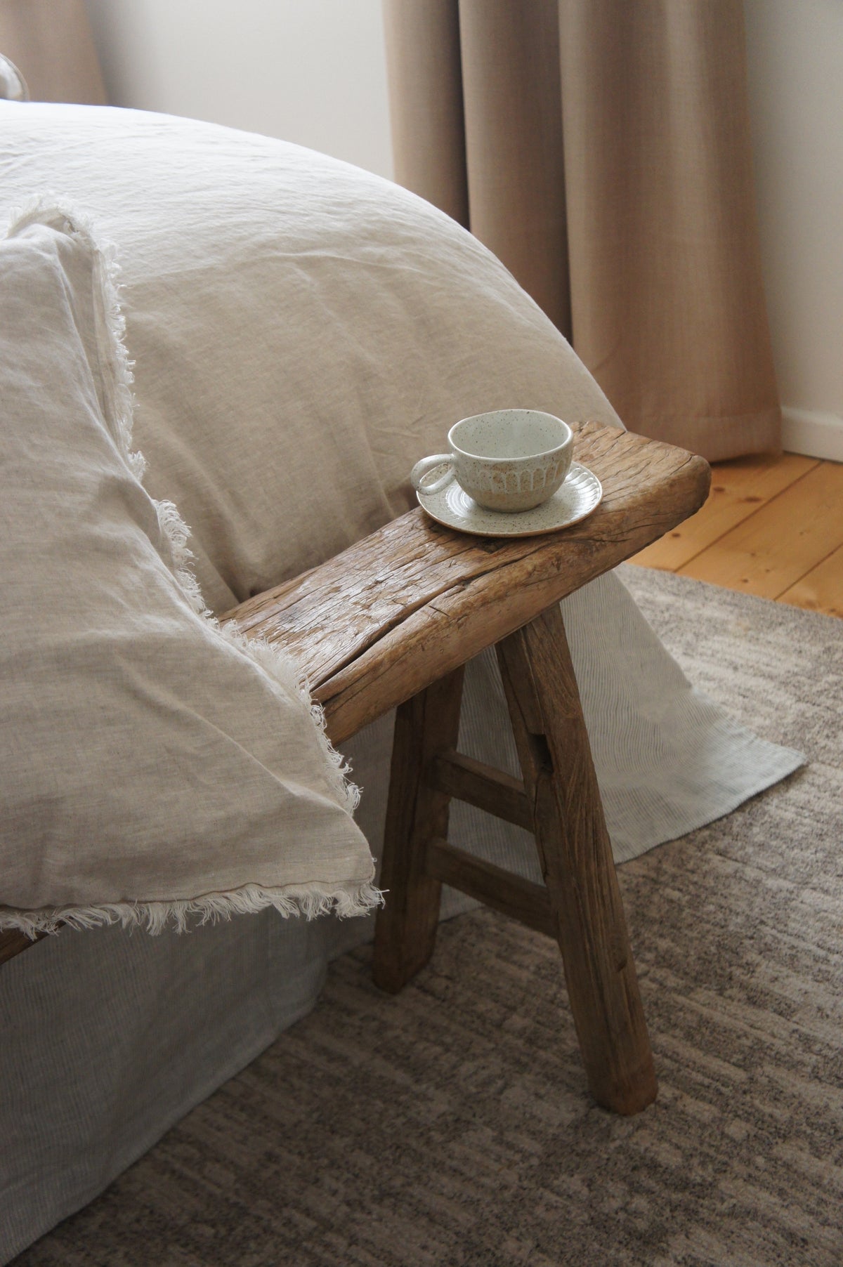 SOL Linen Sable frayed linen duvet cover on a bed, showcasing its soft, textured fabric and relaxed bedding style.