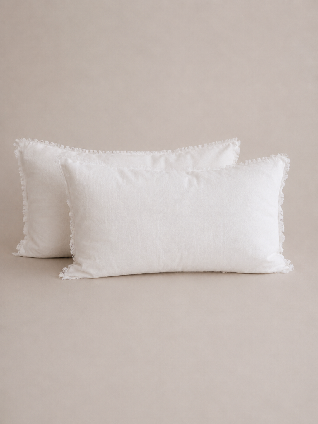 Pair of SOL Linen Whistler Frayed Linen Pillowcases set, soft and textured bedding accessories in natural linen fabric.